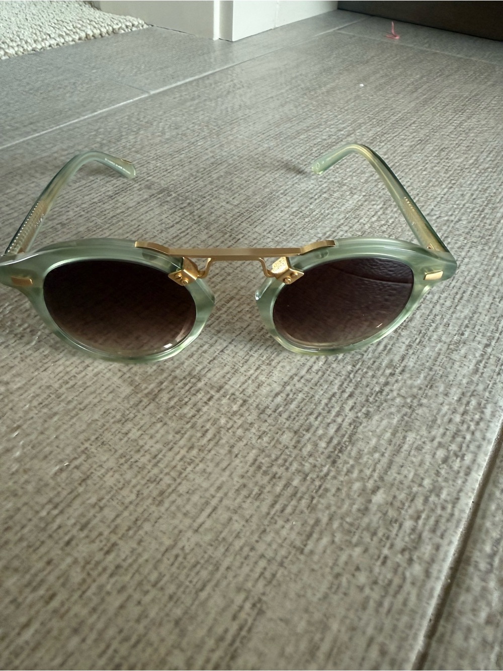 KREWE Translucent Sage Green Round Sunglasses with Gold Bridge